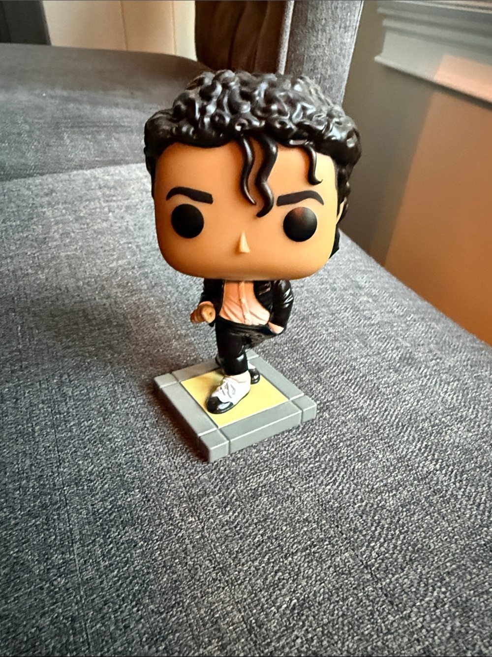 Funko Vinyl Figure with Black Hair and Tan Face